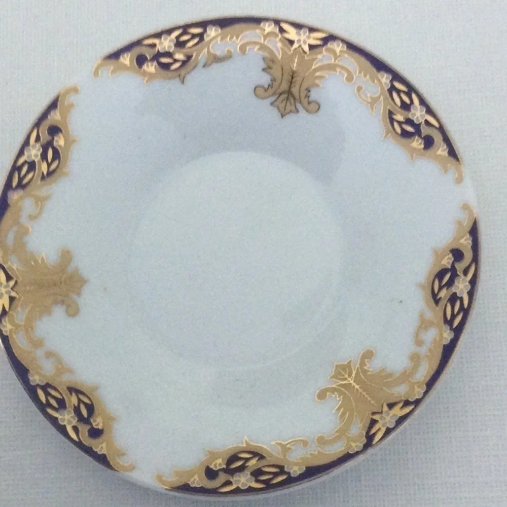 Demitasse Cup and Saucer made in China very pretty design gold white & blue